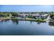 Beautiful aerial view of waterfront condominium complex with private boat dock and lush landscaping at 151 N Orlando Ave # 204, Winter Park, FL 32789