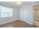 Bright and airy bedroom with ceiling fan, closet, plank flooring, and natural light at 151 N Orlando Ave # 204, Winter Park, FL 32789