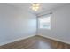 Empty bedroom with vinyl plank flooring, window and ceiling fan at 151 N Orlando Ave # 204, Winter Park, FL 32789