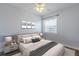 Cozy bedroom featuring a cushioned headboard and modern lamps at 151 N Orlando Ave # 204, Winter Park, FL 32789