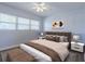 Bright bedroom with a fan, window and a cozy atmosphere at 151 N Orlando Ave # 204, Winter Park, FL 32789