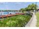 Picturesque dock with boat slips surrounded by lush greenery and peaceful water views at 151 N Orlando Ave # 204, Winter Park, FL 32789