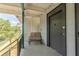Inviting front porch with seating, offering a charming entrance to the residence at 151 N Orlando Ave # 204, Winter Park, FL 32789