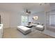 Inviting living room includes stylish seating, outdoor access, and tile flooring at 151 N Orlando Ave # 204, Winter Park, FL 32789