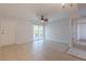 Spacious living room with access to balcony and neutral decor at 151 N Orlando Ave # 204, Winter Park, FL 32789