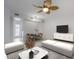 Nicely appointed living room with stylish furniture, ceiling fan, and dining area at 151 N Orlando Ave # 204, Winter Park, FL 32789
