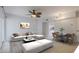 Bright living room boasts modern furnishings, a ceiling fan, and seamless access to dining area and kitchen at 151 N Orlando Ave # 204, Winter Park, FL 32789