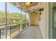 Large tiled, enclosed patio featuring ceiling fans and patio furniture at 151 N Orlando Ave # 204, Winter Park, FL 32789