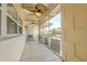 Spacious outdoor tiled patio with modern fans and railings at 151 N Orlando Ave # 204, Winter Park, FL 32789