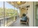 Enclosed patio featuring comfortable outdoor seating and decorative ceiling fans at 151 N Orlando Ave # 204, Winter Park, FL 32789