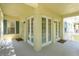 Wide balcony with multiple doors and windows letting in natural light offers a great entertainment space at 1630 Common Way Rd # 203, Orlando, FL 32814