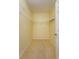 An empty walk-in closet with ample space for storage and organization at 1630 Common Way Rd # 203, Orlando, FL 32814