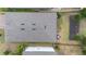 Aerial view of the roof and backyard, including a patio with outdoor furniture and fence at 17199 Hickory Wind Dr, Clermont, FL 34711