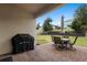 View of the backyard showcasing a patio with outdoor furniture and a grill at 17199 Hickory Wind Dr, Clermont, FL 34711