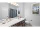 Bathroom featuring a shower and tub, vanity, and neutral color palette at 17199 Hickory Wind Dr, Clermont, FL 34711