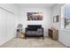 Bedroom featuring a dark crib and side shelving with wall art at 17199 Hickory Wind Dr, Clermont, FL 34711