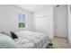 Bedroom featuring a large bed with a patterned comforter, carpeted floors, and a closet at 17199 Hickory Wind Dr, Clermont, FL 34711