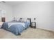 Cozy bedroom featuring a comfortable bed and side tables, providing ample space at 17199 Hickory Wind Dr, Clermont, FL 34711