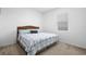 Bright bedroom featuring a queen bed, plush carpeting, and ample natural light at 17199 Hickory Wind Dr, Clermont, FL 34711