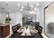 Dining area and kitchen that opens to a living room with comfy seating and a large sliding door to outside at 17199 Hickory Wind Dr, Clermont, FL 34711