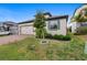 Well-maintained front yard with lush green grass and manicured landscaping at 17199 Hickory Wind Dr, Clermont, FL 34711