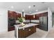 Contemporary kitchen with stainless steel appliances and a large center island at 17199 Hickory Wind Dr, Clermont, FL 34711
