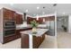 Modern kitchen boasts granite countertops, stainless steel appliances, and ample cabinet space at 17199 Hickory Wind Dr, Clermont, FL 34711