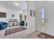 Inviting foyer featuring tile flooring, elegant furnishings, and a bright entryway with natural light at 17333 Hickory Wind Dr, Clermont, FL 34711