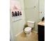 Bathroom featuring tile flooring, a toilet, and a single sink vanity at 17517 Silver Creek Ct, Clermont, FL 34714