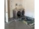 Functional laundry room with modern washer and dryer, offering convenience and efficiency at 17517 Silver Creek Ct, Clermont, FL 34714