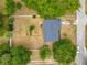 Aerial shot of fenced property featuring a well-maintained roof at 181 Ada Ave, Orange City, FL 32763