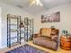 Inviting living room with dark brown recliner, decorative shelves, and Jim Beam barrel table at 181 Ada Ave, Orange City, FL 32763