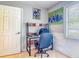 Functional office featuring a modern desk, comfortable chair, and natural light from the window at 181 Ada Ave, Orange City, FL 32763
