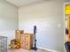 Empty room with moving boxes, a vacuum cleaner, and light gray walls at 181 Ada Ave, Orange City, FL 32763