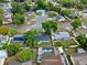 An aerial view showing the home, the surrounding neighborhood and the enclosed pool at 1816 Haperon St, Apopka, FL 32703