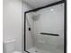 A shower featuring black trim and light-colored tiling at 1816 Haperon St, Apopka, FL 32703