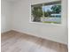 Bright bedroom with new hardwood floors and a large window offering ample natural light at 1816 Haperon St, Apopka, FL 32703