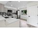 Updated kitchen featuring stainless steel appliances, quartz countertops, and stylish backsplash at 1816 Haperon St, Apopka, FL 32703