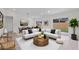 Bright, neutrally-toned open-concept living room and dining area with sleek flooring and modern furniture at 1816 Haperon St, Apopka, FL 32703