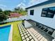 Backyard view showing a pool and a patio space with pavers at 182 N Phelps Ave, Winter Park, FL 32789