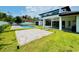 Lush backyard with pool, patio, and ample green space, perfect for outdoor living and entertaining at 182 N Phelps Ave, Winter Park, FL 32789