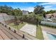 Modern home backyard with an in-ground pool and glass balcony railing at 182 N Phelps Ave, Winter Park, FL 32789