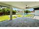 Beautiful backyard featuring a covered patio, pool, manicured lawn, and concrete tile walkway at 182 N Phelps Ave, Winter Park, FL 32789