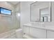 Modern bathroom featuring a walk-in shower and floating vanity at 182 N Phelps Ave, Winter Park, FL 32789
