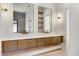 This primary bathroom features dual sinks, decorative lighting and shelving for ample storage at 182 N Phelps Ave, Winter Park, FL 32789