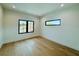 Bright bedroom with wood floors, black window frames and recessed lighting at 182 N Phelps Ave, Winter Park, FL 32789