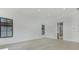 A bedroom featuring bright light from one window and a glimpse into an ensuite bathroom at 182 N Phelps Ave, Winter Park, FL 32789