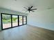 Bright bedroom featuring a ceiling fan, and large windows with a view at 182 N Phelps Ave, Winter Park, FL 32789