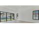 Bright bedroom with large windows overlooking a pool and backyard at 182 N Phelps Ave, Winter Park, FL 32789