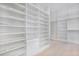 Large walk-in closet with lots of custom shelves and drawers at 182 N Phelps Ave, Winter Park, FL 32789